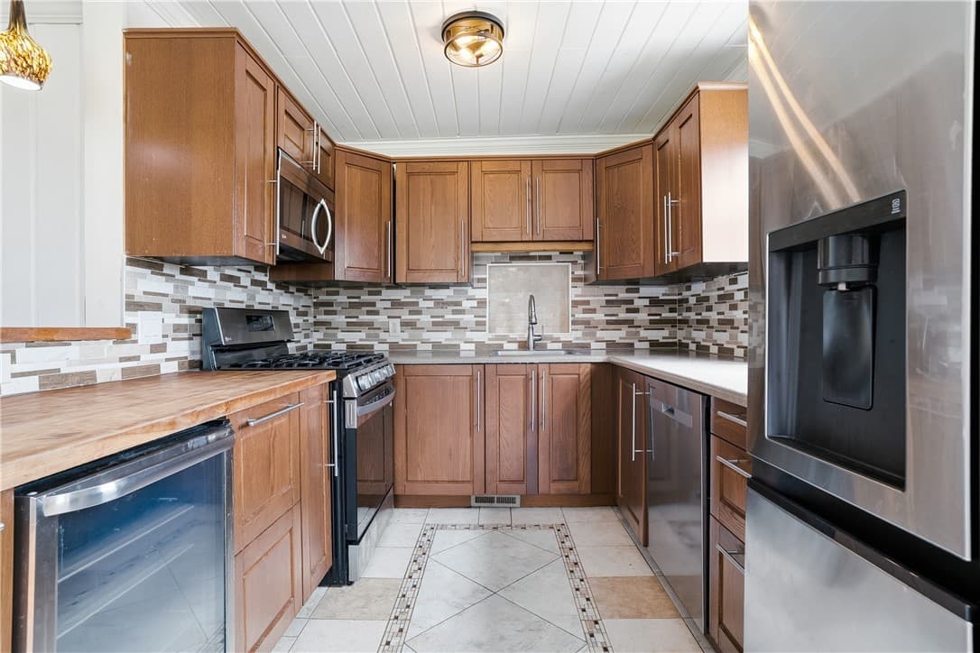 Kitchen with wood cabinets and stainless steel appliances